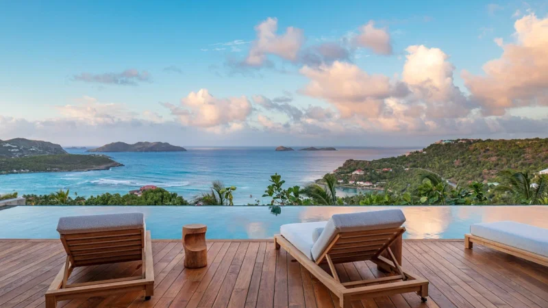 Private villa pool area with tropical landscaping
